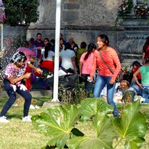 Fighting girls in front of the church